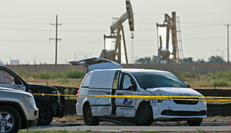 A U.S. Mail vehicle, right, which was involved in Saturday's shooting, is pictured outside the Cinergy entertainment center Sunday, Sept. 1, 2019, in Odessa, Texas. 