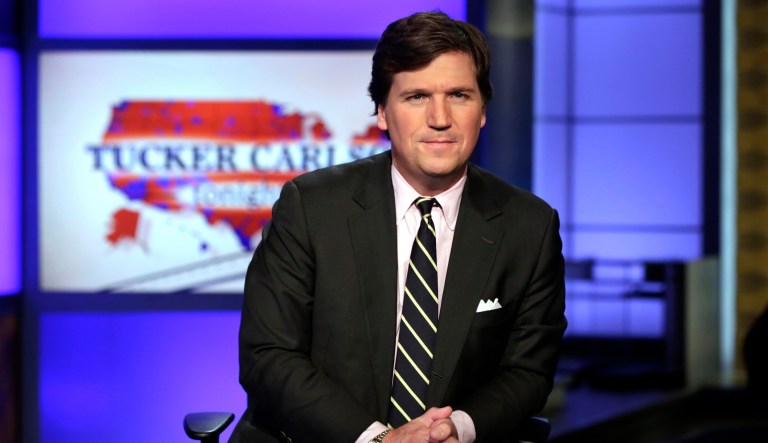 FILE - In this March 2, 2017 file photo, Tucker Carlson, host of "Tucker Carlson Tonight," poses for photos in a Fox News Channel studio in New York.