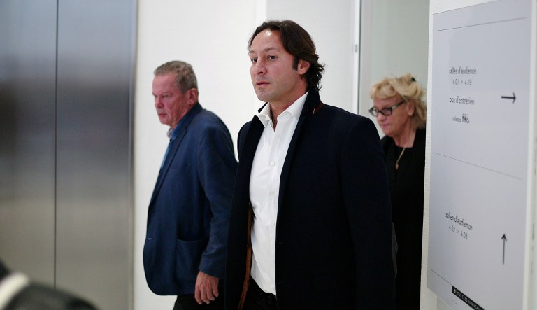 Saudi Princess Hassa bint Salman's bodyguard Rani Saidi, center, leaves the courthouse, in Paris, Thursday, Sept. 12, 2019. The only daughter of Saudi Arabia's King Salman has been found guilty by a Paris court of charges that she ordered her bodyguard to detain and strike a plumber for taking photos at the Saudi royal family's apartment in the French capital. 