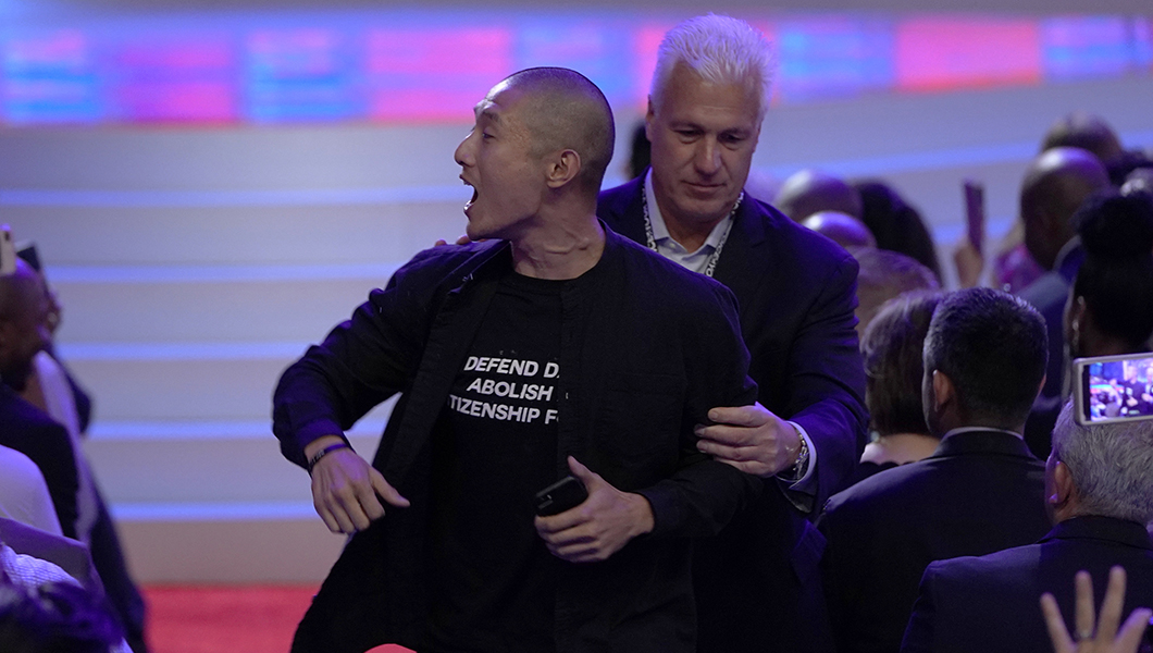 Left-wing protesters interrupt Biden on immigration during Democratic 2020 debate