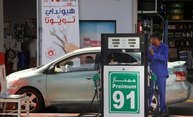 A worker refuels a car at a gas station in Jiddah, Saudi Arabia, Monday, Sept. 16, 2019. Global energy prices spiked on Monday after a weekend attack on key oil facilities in Saudi Arabia caused the worst disruption to world supplies on record, an assault for which President Donald Trump warned that the U.S. was "locked and loaded" to respond. 