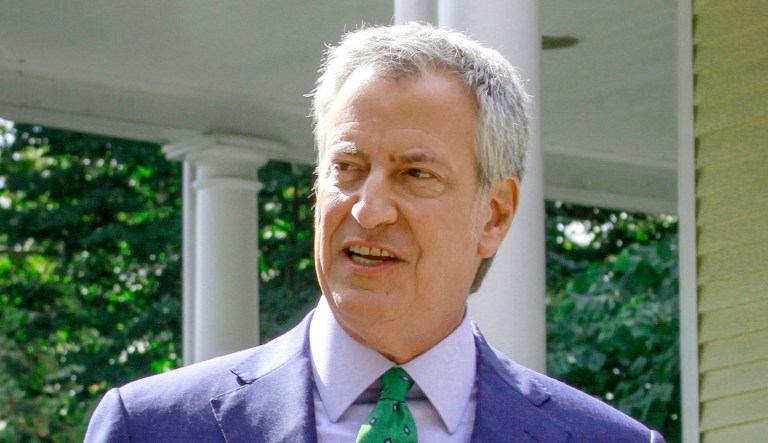 New York City mayor Bill de Blasio, left, speaks during a news conference in front of Gracie Mansion with his wife, Chirlane McCray, in New York.