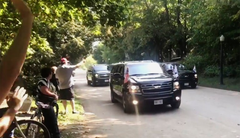 In this Saturday, Sept. 21, 2019, image made from video, Vice President Mike Pence leaves the Grand Hotel in an eight-vehicle motorcade on Mackinac Island, Mich. 