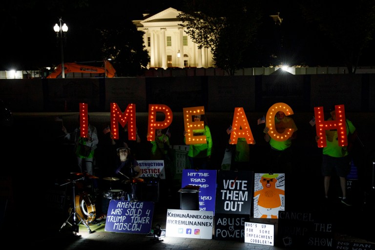 Protesters with "Kremlin Annex" call to impeach President Donald Trump in Lafayette Square Park in front of the White House in Washington, Tuesday, Sept. 24, 2019.