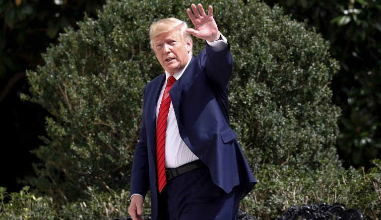 President Donald Trump gestures toward members of the media on the South Lawn of the White House in Washington, Thursday, Sept. 26, 2019, after returning from United Nations General Assembly. 