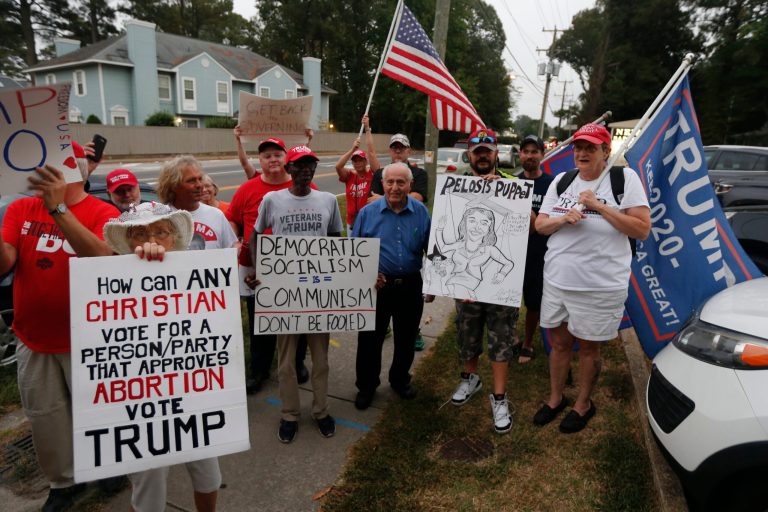 Trump supporters demonstrate outside a town hall by Virginia Rep. Elaine Luria. Her district is being targeted by the GOP in its anti-impeachment effort.