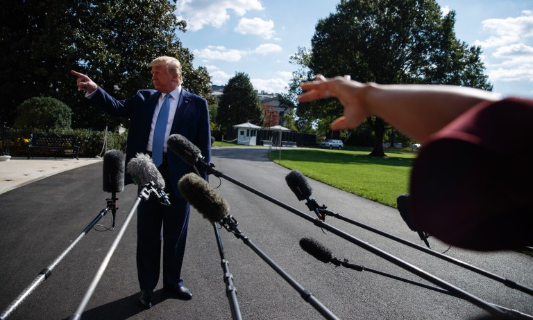 President Donald Trump takes questions from reporters about impeachment on the South Lawn of the White House. (AP Photo/Evan Vucci) 

