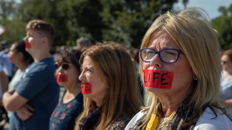 Cathy Haggstrom from Odessa, Fla., joins anti-abortion activists in front of the U.S. Supreme Court, Monday, Oct. 7, 2019, in Washington. 
