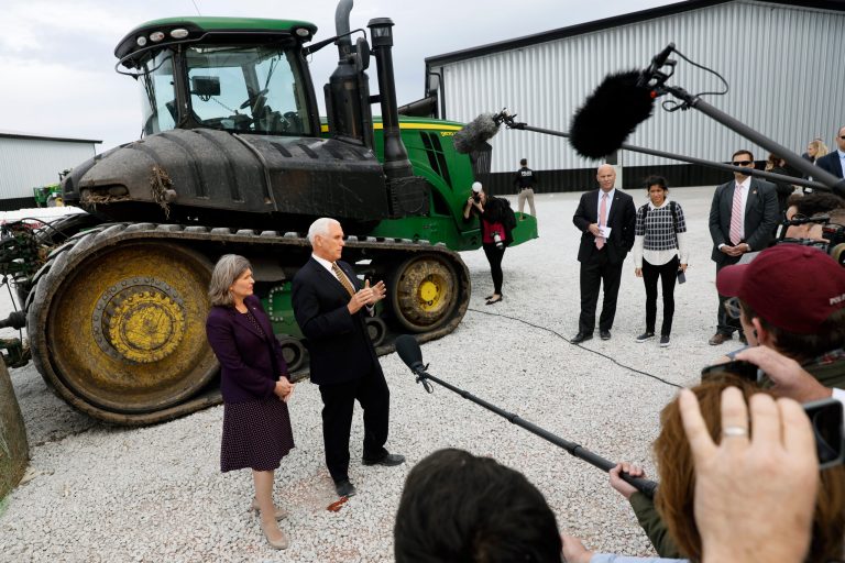 Vice President Mike Pence and Sen. Joni Ernst, R-Iowa, left, speak to reporters during a visit to the Manning Farms, Wednesday, Oct. 9, 2019, in Waukee, Iowa.