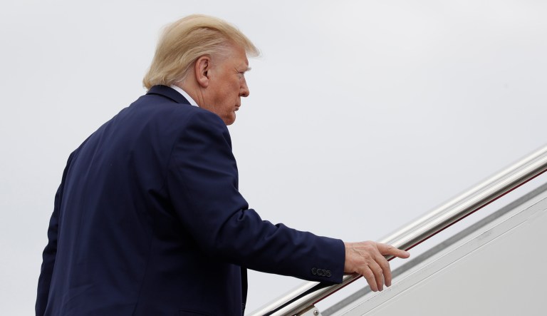 President Trump boards a plane.