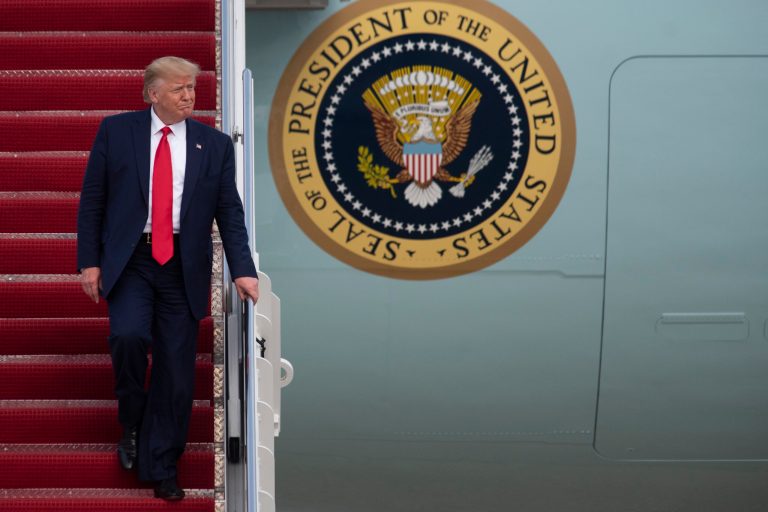 President Donald Trump walks from Air Force One at Andrews Air Force Base, Md., following a trip to South Carolina on Friday.