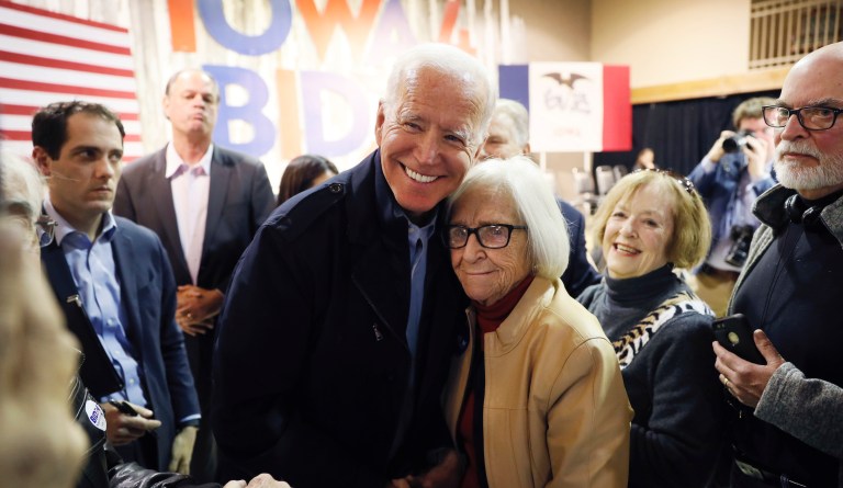 Democratic presidential candidate former Vice President Joe Biden gets a hug from Diane Burch, of Fort Dodge, Iowa, during a town hall meeting, Thursday, Oct. 31, 2019, in Fort Dodge, Iowa.
