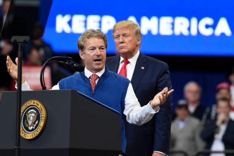 President Donald Trump listens as Sen. Rand Paul, R-Ky., speaks during a campaign rally in, Lexington, Ky., Monday, Nov. 4, 2019. 