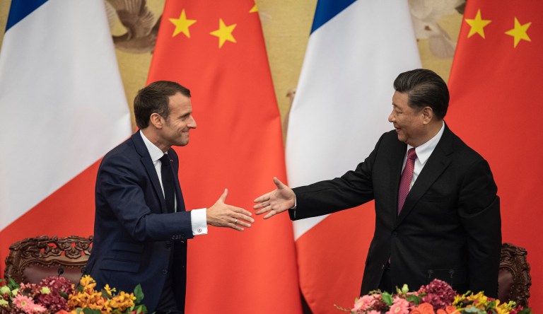 France’s Macron bows before Xi before even arriving in Beijing
