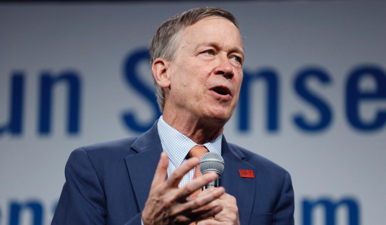 FILE - In this Aug. 10, 2019, file photo, then Democratic presidential candidate former Colorado Gov. John Hickenlooper speaks at the Presidential Gun Sense Forum in Des Moines, Iowa. The Colorado Ethics Commission is releasing an investigation into John Hickenlooper's use of private planes while governor. A Republican critic filed a complaint alleging Hickenlooper had improperly traveled on private flights during his administration.