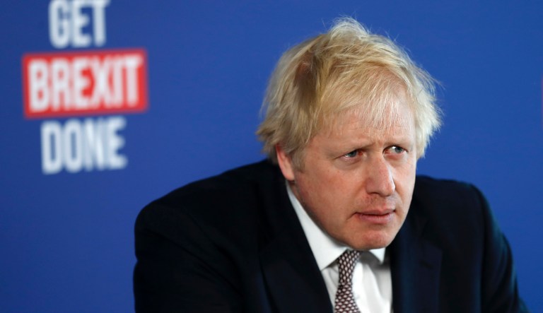Britain's Prime Minister Boris Johnson listens to a question during a media conference in London, Friday, Nov. 29, 2019. 