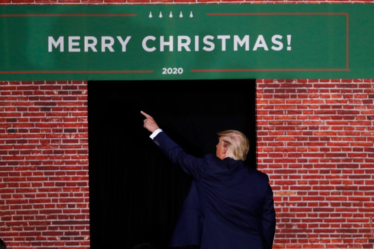 President Donald Trump points as he leaves a campaign rally in Battle Creek, Mich., Wednesday, Dec. 18, 2019.
