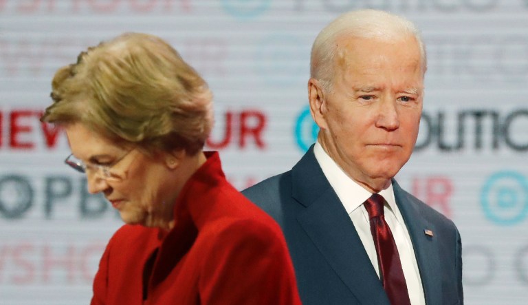 Democratic presidential candidates Sen. Elizabeth Warren, D-Mass., left, and former Vice President Joe Biden stand on stage during a break at a Democratic presidential primary debate Thursday, Dec. 19, 2019, in Los Angeles.