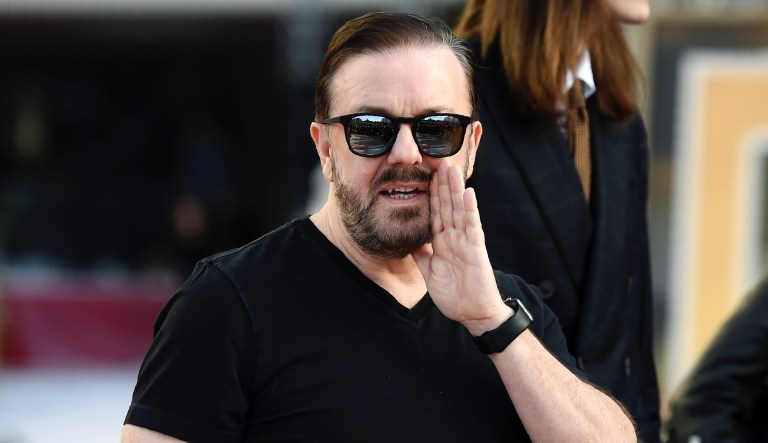 Ricky Gervais, host of this Sunday's 77th Annual Golden Globe Awards, banters with members of the media during Preview Day for the Globes at the Beverly Hilton, Friday, Jan. 3, 2020, in Beverly Hills, Calif.    