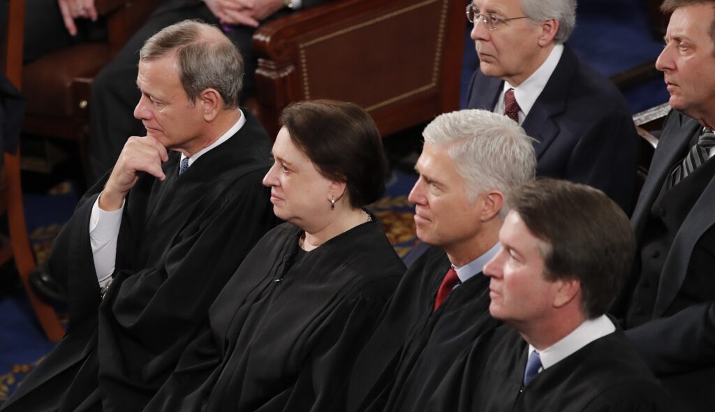 Chief Justice of the United States John Roberts, from left, Supreme Court Associate Justice Elena Kagan, Supreme Court Associate Justice Neil Gorsuch, and Supreme Court Associate Justice Brett Kavanaugh listen to President Donald Trump deliver his State of the Union address to a joint session of Congress on Capitol Hill in Washington, Tuesday, Feb. 4, 2020.