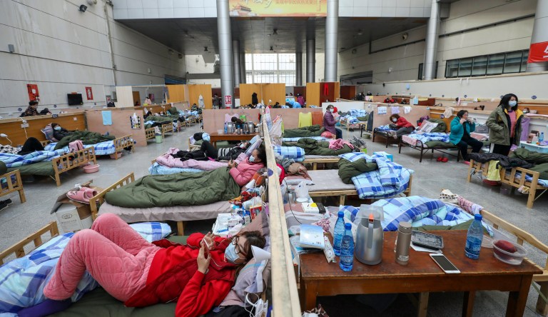 Satellite images show Wuhan hospitals swamped months before China reported coronavirus outbreak