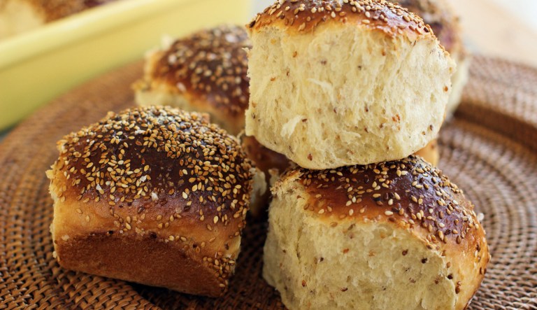 This Oct. 12, 2015, photo, shows sweet sesame dinner rolls in Concord, N.H. This recipe is a cross between an Italian scali bread, a light, tender bread crusted in sesame seeds, and a Portuguese sweet roll.