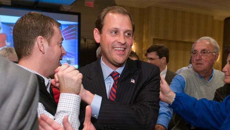 Republican Andy Barr makes his way through supporters.