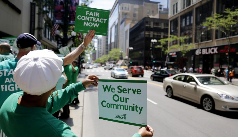 Members of the American Federation of State, County and Municipal Employees protest in Chicago.