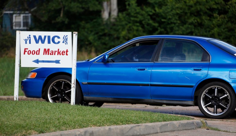 A vehicle pulls up to the Special Supplemental Nutrition Program for Women, Infants and Children, better known as WIC, center in Jackson, Miss.