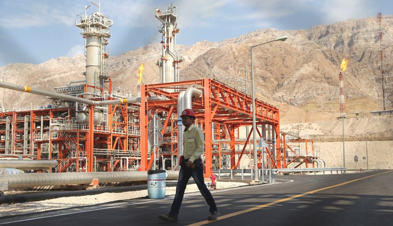 A worker makes his way in a natural gas refinery in the South Pars gas field in Asalouyeh, Iran, on the northern coast of the Persian Gulf.