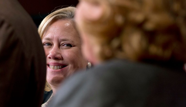Sen. Mary Landrieu, D-La., looks over at Sen. Heidi Heitkamp, D-N.D., while they participate in a news conference on Capitol Hill in Washington, Tuesday, Nov. 18, 2014.