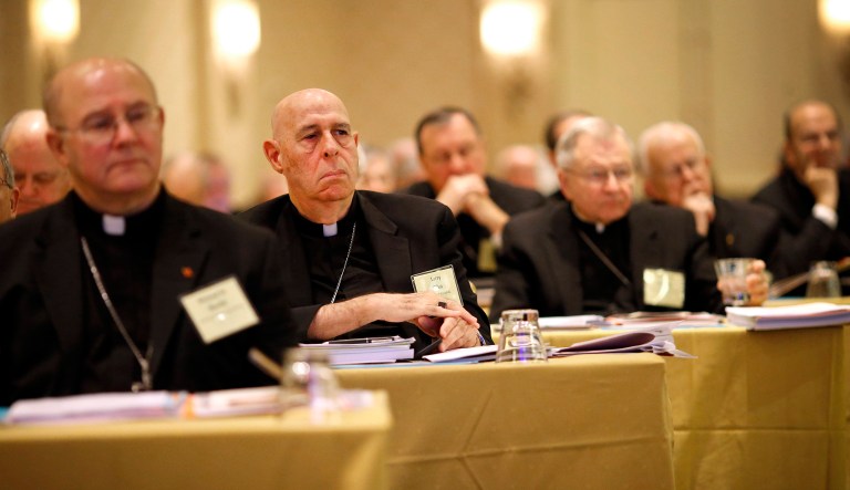 Bishop Larry Silva, of Honolulu, second from left, listens to remarks at the United States Conference of Catholic Bishops' annual meeting in Baltimore.
