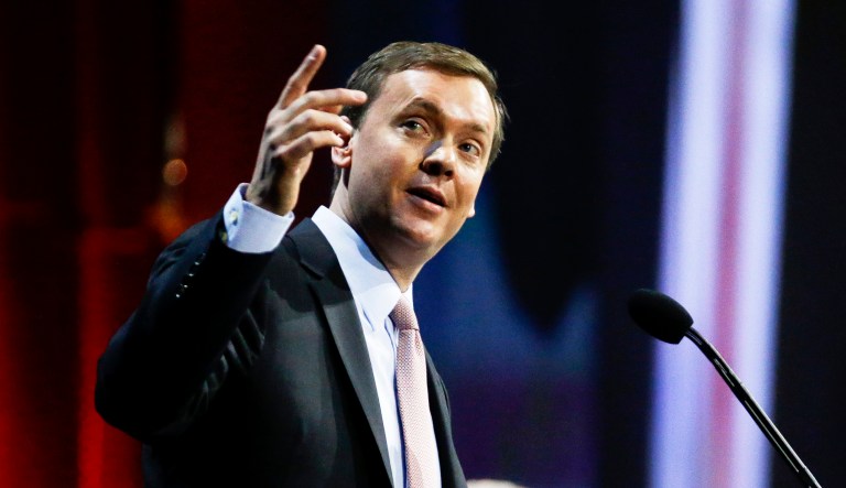 Chris Cox speaks during the annual meeting of members at the NRA convention.