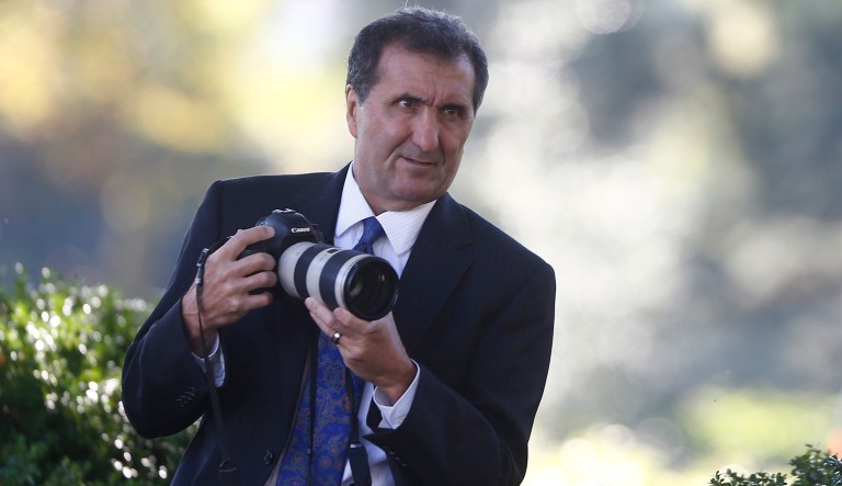 Former official White House photographer Pete Souza works as President Barack Obama speaks during an event in the Rose Garden of the White House. 