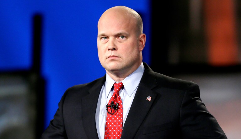 Then-Iowa Republican senatorial candidate Matt Whitaker looks on before a live televised debate in Johnston, Iowa. 