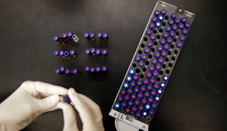 A postdoctoral fellow at Johns Hopkins University works alongside a tray of vials containing cerebral spinal fluid in Baltimore. Dr. Akhilesh Pandey, a researcher at Johns Hopkins University, said his research analyzes both adult and fetal tissue, and by identifying which proteins are present, he can get clues that could be used to help detect cancer in adults earlier. 