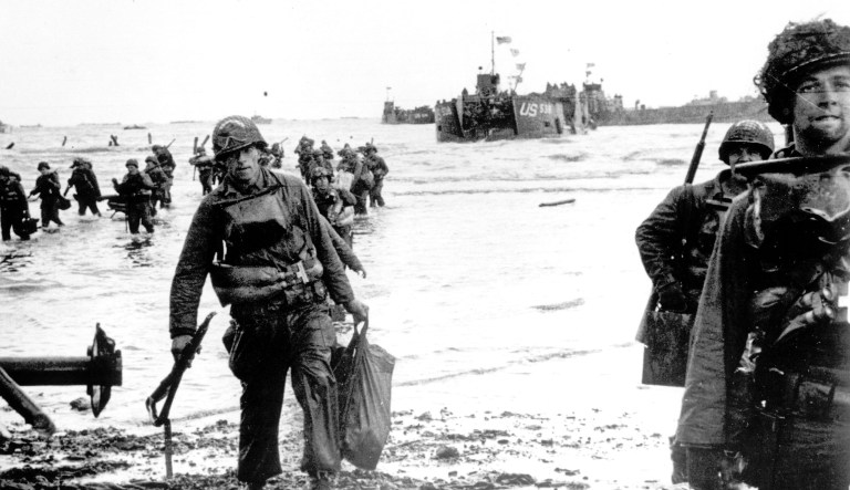 Carrying full equipment, American assault troops move onto a beachhead code-named Omaha Beach, on the northern coast of France on June 6, 1944, during the Allied invasion of the Normandy coast.