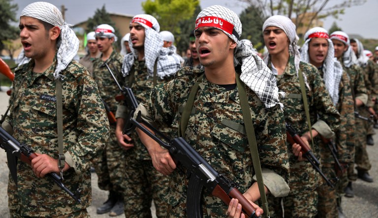 A group of  Iranian paramilitary Basij forces, affiliated to the Revolutionary Guard, shout slogans while attending training in a Guard base in northeastern Tehran, Iran, Friday, April 24, 2015. The volunteer Basij force is often used to quell civil unrest and oversea civilian behavior.