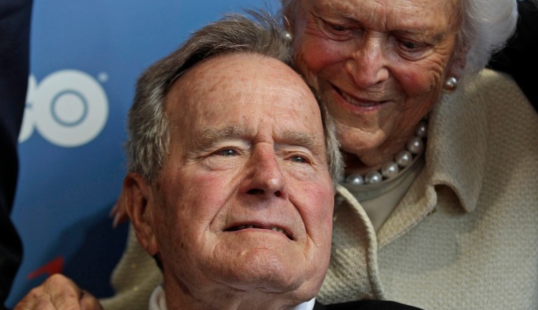 In this June 12, 2012 file photo, former President George H.W. Bush and his wife, Barbara, arrive for the premiere of HBO's new documentary about his life in Kennebunkport, Maine.