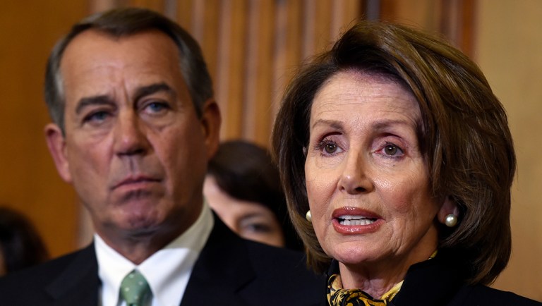 House Speaker John Boehner of Ohio listens at left as House Minority Leader Nancy Pelosi of Calif. speaks on Capitol Hill.