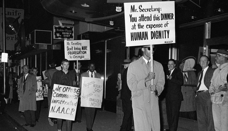 National Association for the Advancement of Colored People pickets march in front of the Dinkler Plaza Hotel in Atlanta on Nov. 11, 1961 protesting the appearance of Defense Secretary Robert S. McNamara at a segregated, private dinner honoring Sen. Richard B. Russell and Rep. Carl Vinson, veteran Georgia Democrats. Picketing the NAACP pickets were a group of five white youths from an organization known as the Knights of the Confederacy, a segregationist group.