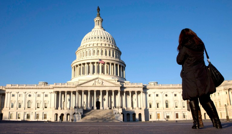 A woman stands near the U.S. Capitol in Washington, D.C.