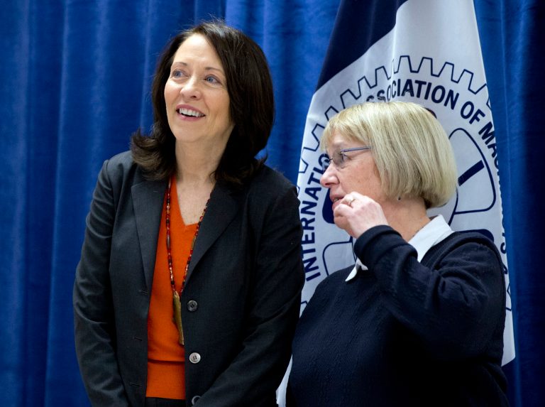Sen. Patty Murray, D-Wash., right, and Sen. Maria Cantwell, D- Wash., stand together as Democratic presidential candidate Hillary Clinton speaks during a campaign event at the IAM District 751 Everett Union Hall in Everett, Wash., Tuesday, March 22, 2016.