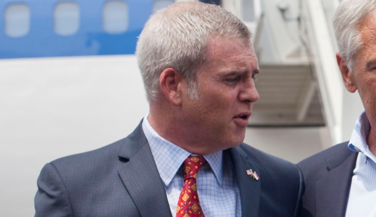 U.S. Defense Secretary Chuck Hage, right, is greeted by U.S. Ambassador to Singapore Kirk Wagar, left, upon his arrival in Singapore, Friday, May 30, 2014. Hagel arrived in Singapore to attend the 13th Asia Security Summit.