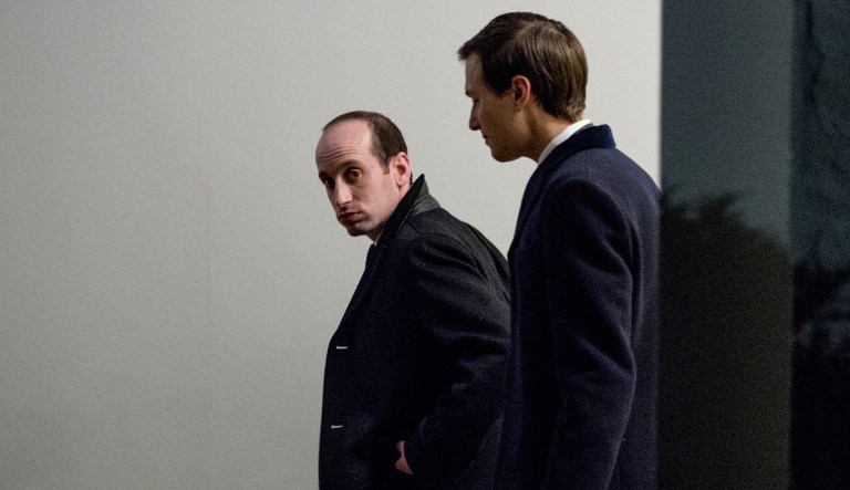 White House Senior Advisers Stephen Miller, left, and Jared Kushner, right, walk along the colonnade to the West Wing after arriving to the White House in Washington, Wednesday, March 15, 2017, after traveling to Detroit and Nashville with President Donald Trump.