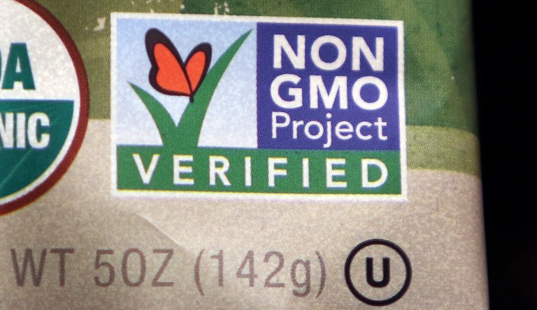 A package label identifies a food product that does not contain genetically modified ingredients Friday, March 18, 2016, in Marlborough, Mass.