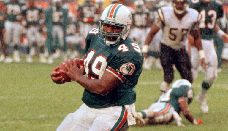 Miami Dolphins fullback Tony Paige goes across the goal line with a touchdown reception in first half action against the San Diego Chargers in Miami during the AFC playoff game, Jan. 10, 1993.