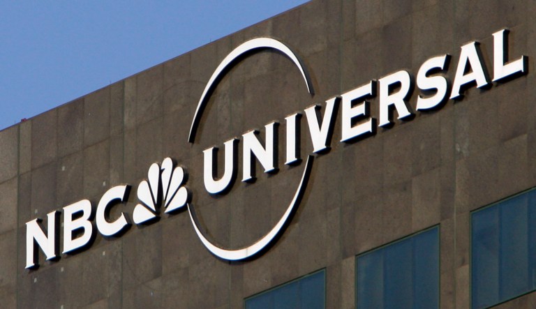 The NBC Universal logo hangs on a building in Los Angeles.