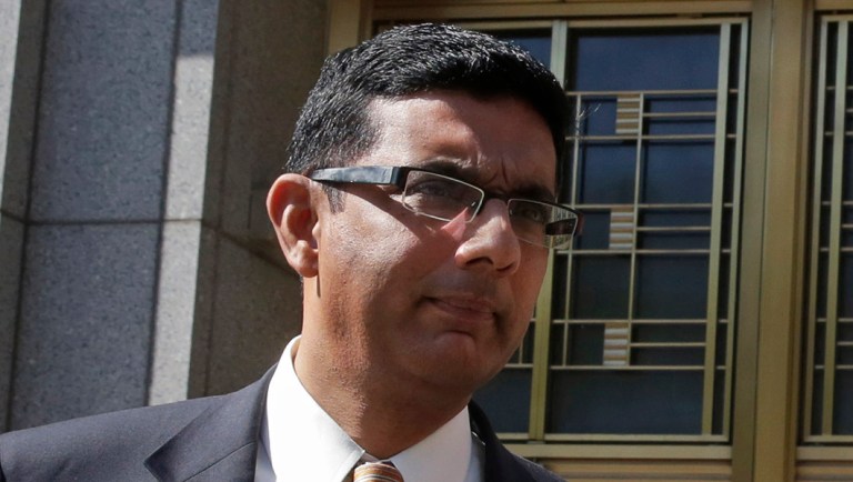 Conservative scholar and filmmaker Dinesh D'Souza, left, accompanied by his lawyer Benjamin Brafman leave federal court, in New York,  Tuesday, May 20, 2014.  D'Souza has pleaded guilty in New York federal court to making illegal campaign contributions. He admitted getting two close associates to make $10,000 contributions to Wendy Long. She was a candidate who lost the New York Senate race in 2012 to the Democratic incumbent. His plea agreement calls for a sentence of 10 to 16 months in prison. He'll be sentenced on Sept. 23. 