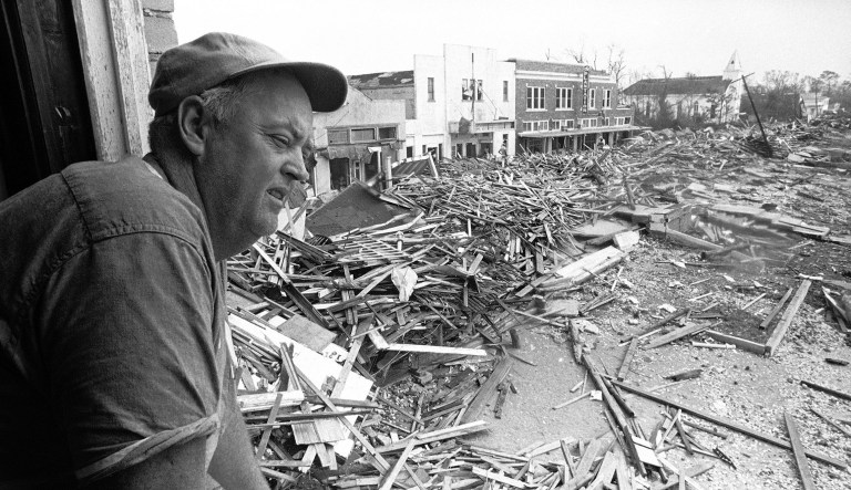 In this Aug. 23, 1969 file photo, Pass Christian Civil Defense Director Parnell McKay looks over the townâs main business district after Hurricane Camille passed through. Camille was a Category 5 storm when it made landfall along the Mississippi coast on Aug. 17, 1969, with maximum sustained winds estimated at nearly 200 mph and a devastating storm surge.